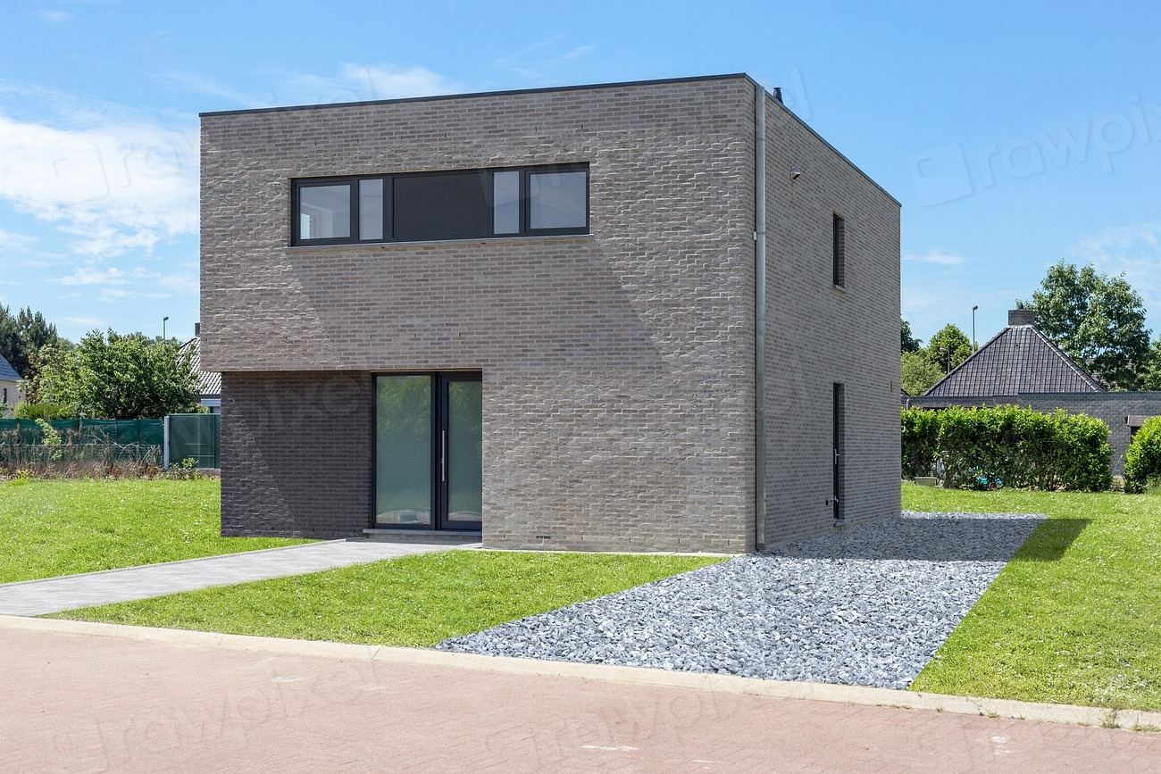 Modern new-build house with a clean cubic design and landscaped front