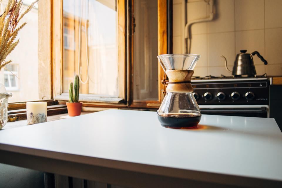 Bright kitchen counter with a coffee maker by a sunny window