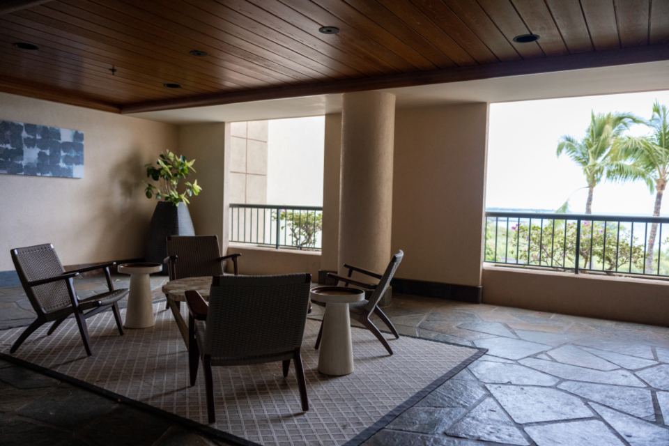 Bright modern lobby lounge with chairs and large windows