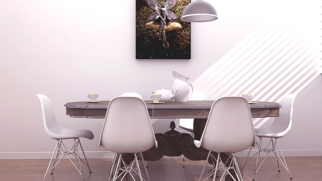 Modern dining table with white chairs and a pendant lamp