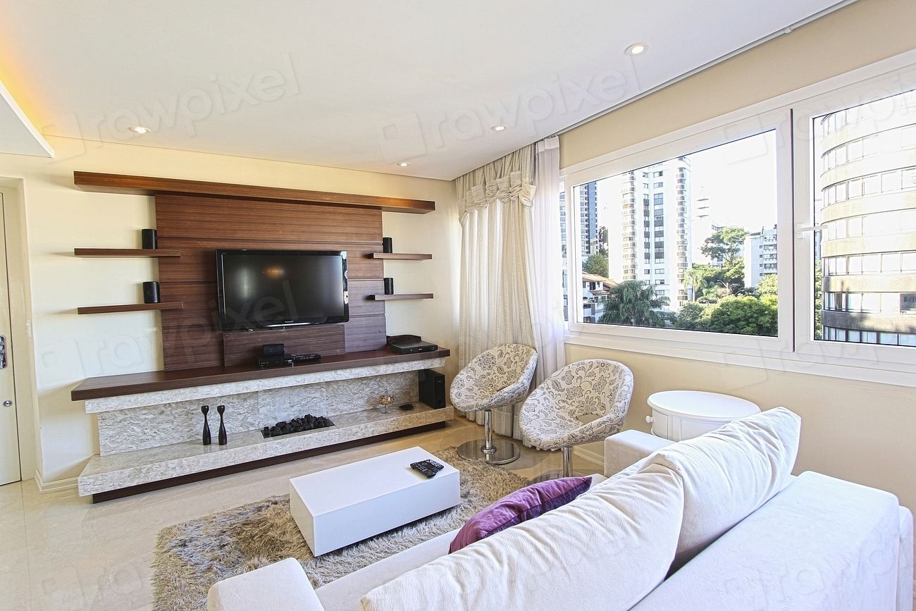 Bright luxury living room with a custom TV wall unit and soft seating