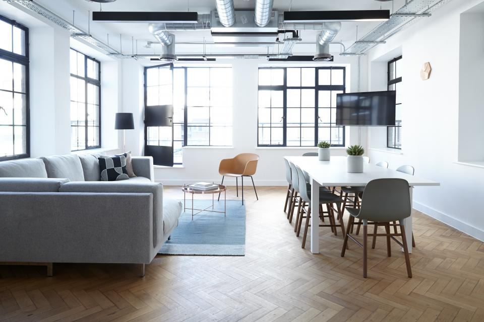 Bright open-plan living and dining space with large windows