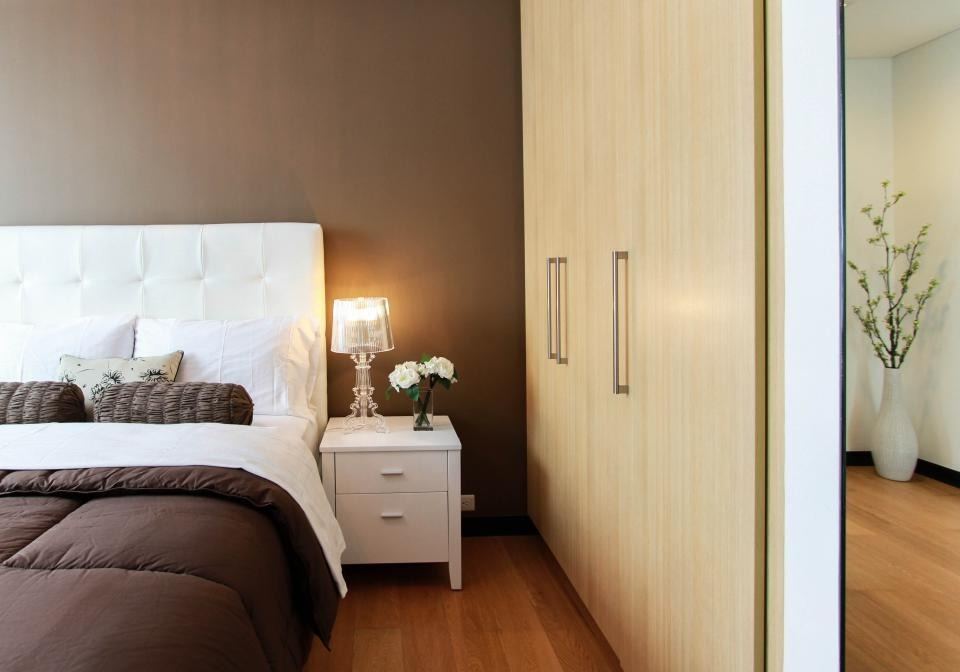 Calm bedroom with a full-height built-in wardrobe